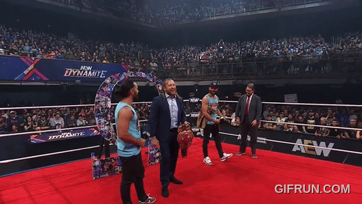 Kenny_Omega_gets_his_NEW_AEW_World_Championship_from_Young_B (1).gif