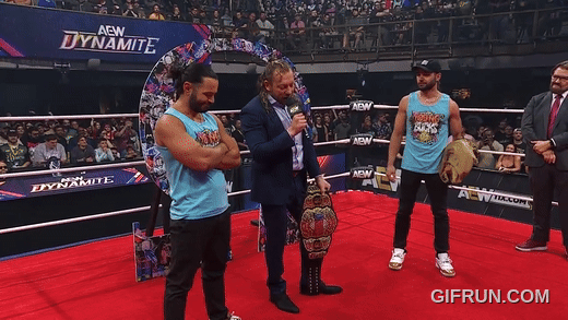 Kenny_Omega_gets_his_NEW_AEW_World_Championship_from_Young_B (2).gif