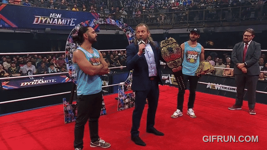 Kenny_Omega_gets_his_NEW_AEW_World_Championship_from_Young_B (4).gif