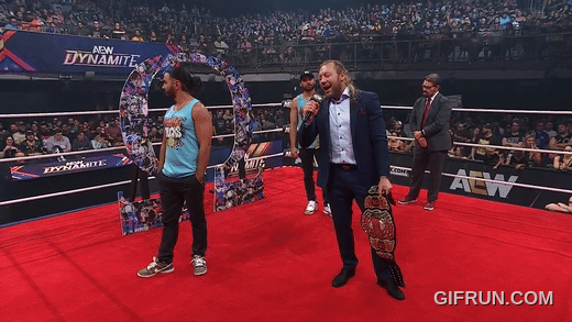 Kenny_Omega_gets_his_NEW_AEW_World_Championship_from_Young_B (5).gif