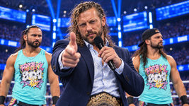 Wrestling-Promo mit Fingerpistole im blauen Arena-Licht.png